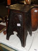 A carved wood stand inscribed to interior 'Kings Royal Rifles carved by A Dingle, The Royal Scots'.
