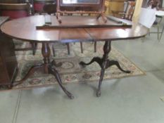 A mahogany double pedestal extending dining table.