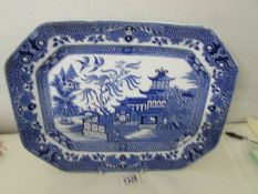 A blue and white willow pattern meat platter,