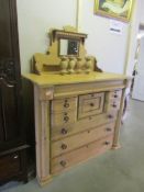 A Victorian Scotch chest of drawers with mirror back (legs detached but present,).