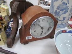 An old mantel clock with 3 winding holes.