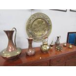 A large brass plaque, copper jugs, brass teapot, 6 brass goblets etc.