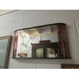 An art deco deep cut mirror with amber glass panels.