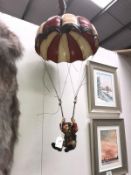 A clown figure with parachute,