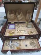 A jewellery box and contents including necklace, chains, earrings etc.