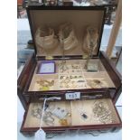 A jewellery box and contents including necklace, chains, earrings etc.