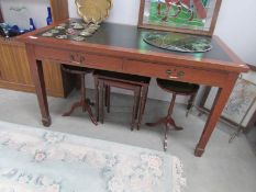 An old writing table with leather inset.