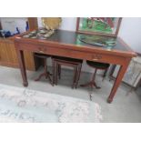 An old writing table with leather inset.