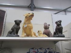 4 dog figures and a cloth dog.