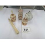 3 19th century ivory scent bottles, a 19th century needle case and one other item.