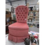 A pink bedroom chair.