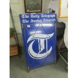 A vintage Daily Telegraph newspaper billboard sign.