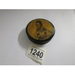 A 19th century lacquered pill box with portrait on top.