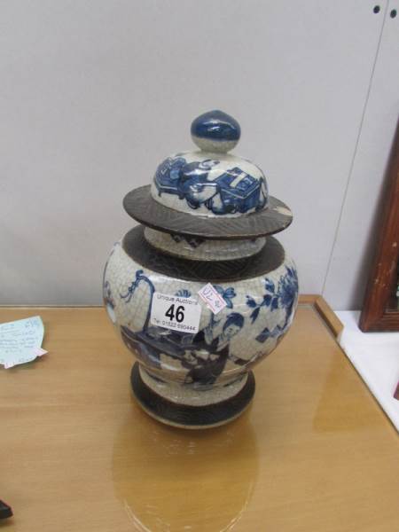 A large old oriental pot with lid (rim a/f).