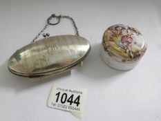 An engine turned silver purse dated 1915 and a painted lidded pot.