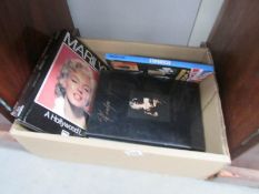 A collection of books including Lady Diana, Lady Gaga,