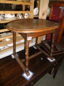 An oval oak stool.