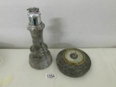 A Cornish serpentine lighthouse as a cigarette lighter and a barometer.