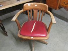 An oak revolving chair.