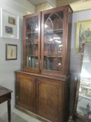 A Victorian astragal glazed book case.