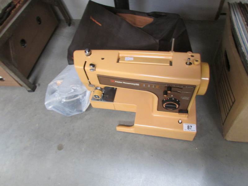 A Frister and Rossman sewing machine with cables, pedal, manual etc, working.