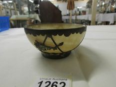 A 19th century Chinese bowl with metal frame (mark on base).