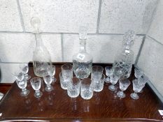 A quantity of glasses & 3 decanters