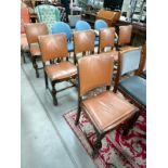 A set of 6 leather upholstered dining chairs