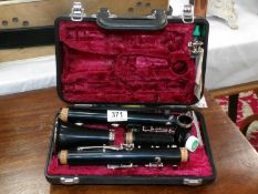 A cased Yamaha clarinet with accessories