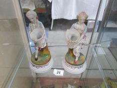 A pair of 19th century continental bisque figurines.