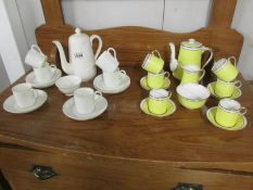 14 pieces of Crown Staffordshire coffee ware and 15 pieces of Royal Albert coffee ware.