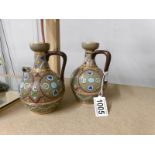 A pair of Edwardian Sarreguemines pottery jugs of Aesthetic design, stamped 1300.