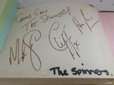 An autograph book including signatures of Cliff Richard, The Spinners, The Three Degrees,