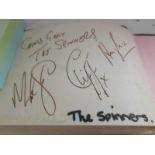 An autograph book including signatures of Cliff Richard, The Spinners, The Three Degrees,