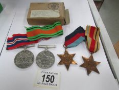 2 WW2 medals and 2 stars with original box.