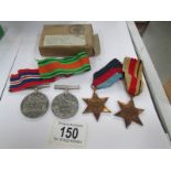 2 WW2 medals and 2 stars with original box.