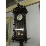 A mahogany wall clock.