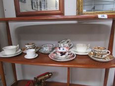 A collection of early tea cups and saucers including Coalport.