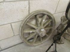 A garden ornament cart wheel.