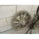 A garden ornament cart wheel.