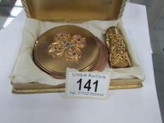 A 1930/40's English 'Melissa' compact and lipstick with bag and in original box.