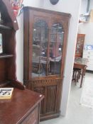 An oak corner cabinet,.