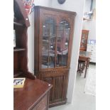 An oak corner cabinet,.