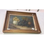 A framed and glazed still life study with grapes.