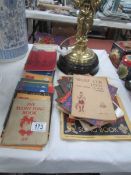 A collection of scout books including song books, 'The Way to the Stars', 'Wolf cub tests',