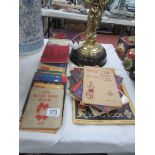 A collection of scout books including song books, 'The Way to the Stars', 'Wolf cub tests',