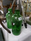 2 19th century green glass chemist bottles.