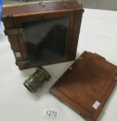 A plate camera with brass lens. (lens marked R. Piectilinear)
