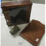 A plate camera with brass lens. (lens marked R. Piectilinear)