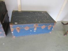 An overpond trunk in blue with black banding.